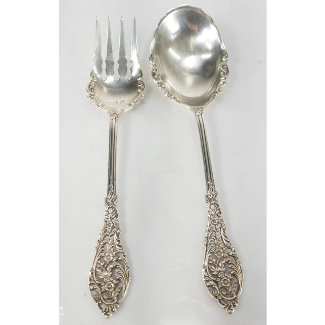 We are listing this great high quality Sterling silver salad serving fork and Spoon. The pair feature rococo style design...