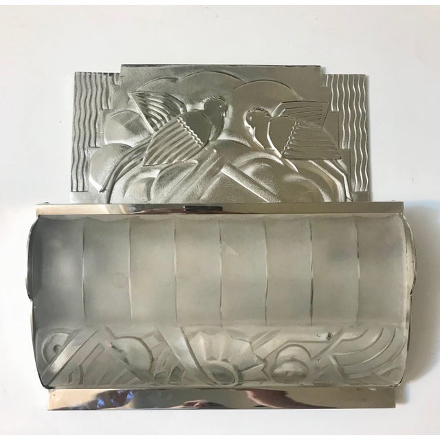 Stunning pair of French Art Deco sconces by Sabino. Having clear frosted molded glass shades enhanced by intricate...