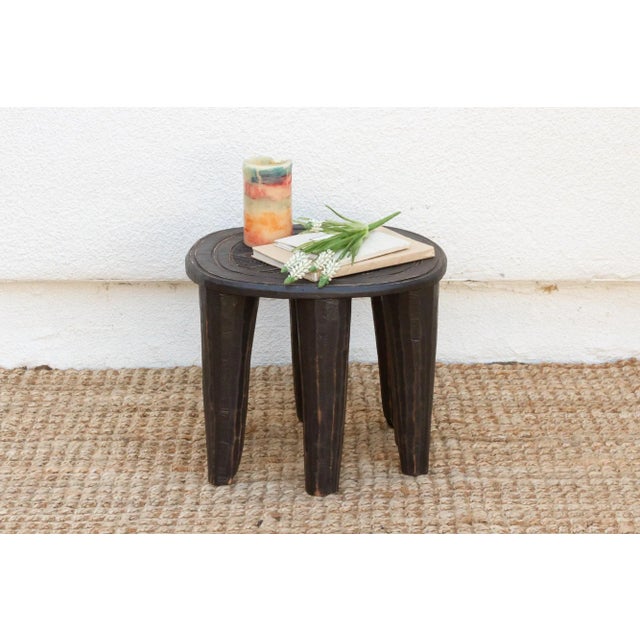 A unique piece of African art, this vintage Nupe table from Nigeria is a must-have for collectors and enthusiasts of Nupe...