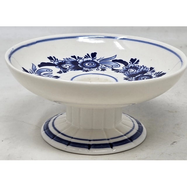 Add classic Dutch charm to your décor with this **Vintage Delft Blue Taper Candle Holder by Elesva Holland, Holland**....