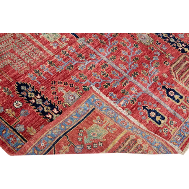 Beautiful modern Bidjar Style hand-knotted wool rug with a red field. This piece has multicolor accents that feature a...