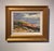 The painting captures a dramatic landscape of red cliffs under a moody sky, where the interplay of light and shadow...