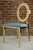 Medallion chair in gilt steel with a turquoise velvet seat.