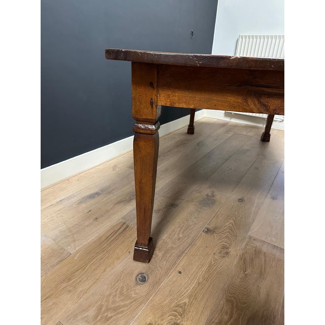 Beautiful antique colonial dining table in perfect condition. The teak has a gorgeous light color and grain. The top is...