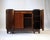 A french art deco buffet from the late 1920s, distinguished by its burl walnut veneer and green verde antico marble top....