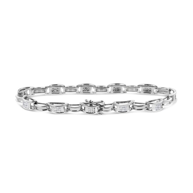 Introducing a dazzling masterpiece that will leave you breathless - a 14K White Gold Tennis Bracelet adorned with 1.0 Cttw...