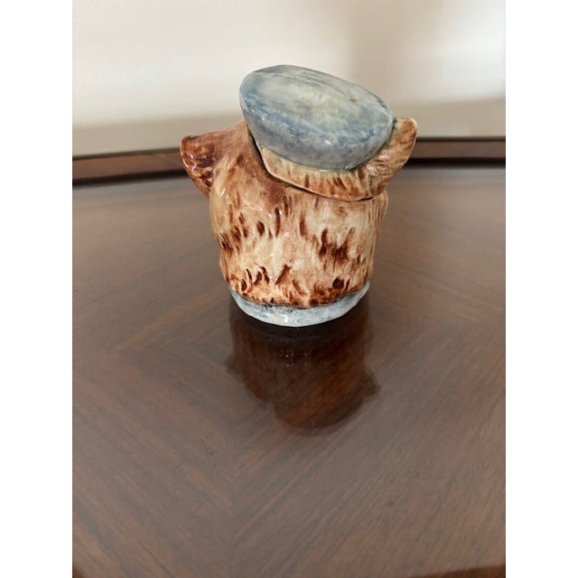 A super sweet antique Austrian Majolica jar in the form of a cat with a blue hat. Most likely 19th century and was used as...