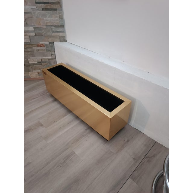 Beautiful planter/plant holder by Hobby Flowers. Barcelona, ​​Spain, 1990s. Brass frame. Interior lined with rigid black...