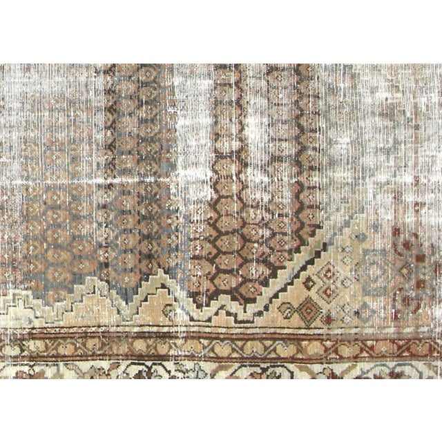 Late 19th Century Persian Melayer Rug. Hand woven in the Hamadan region of Iran. Distressed and refinished in the U.S. The...