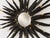 Large Sunburst wall mirror in the Brutalist style, made of cut, worked, and welded metal, likely in Europe around the...