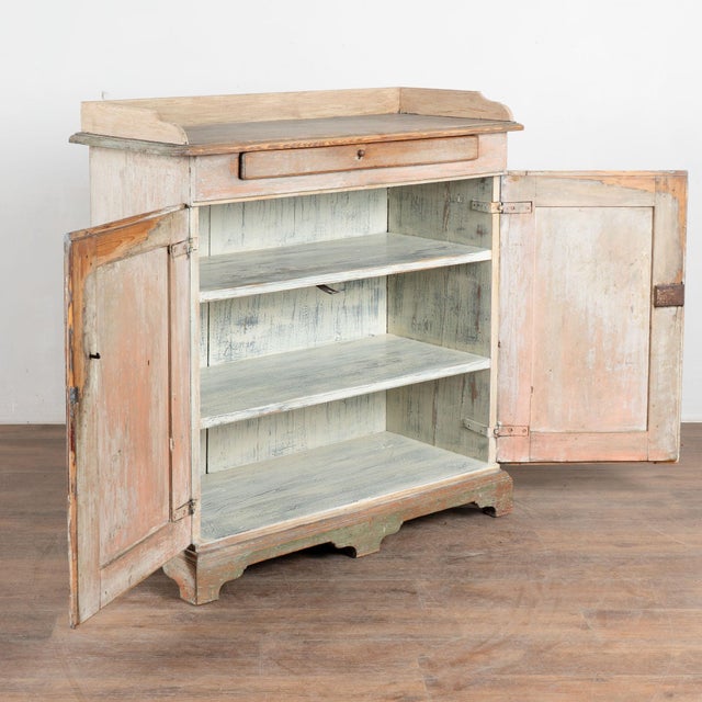 19th century Swedish sideboard, crafted in pine with remnants of its original hand-painted finish. Generations of wear...