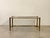 1960s rectangular coffee table in brass and smoked glass top .