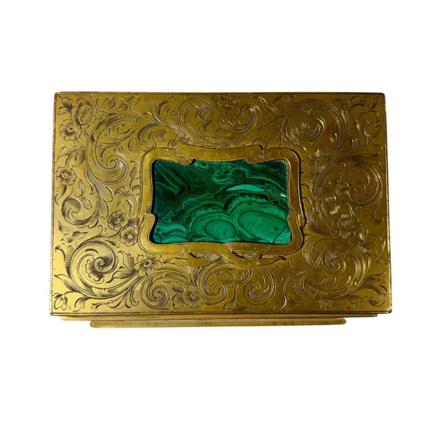 An exceptionally fine 19th century French gilt bronze trinket box featuring elaborate raised scrollwork throughout the...