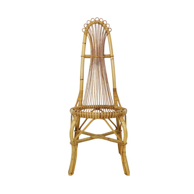 A beautiful mid-century bamboo and rattan designer chair in a distinct boho style, made in Italy during the 1960s. This...