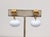 1980s gold-tone spherical ribbed top with white resin "melon" drop clip and screw-back earrings. Marked "NAPIER©" on the...