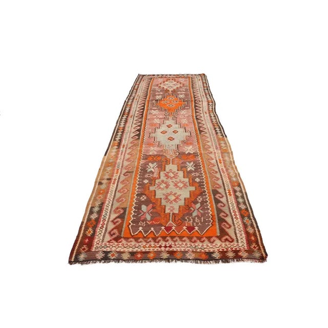 Vintage handwoven decorative kilim rug from Kars region of Turkey. Approximately 50-60 years old. In very good condition.