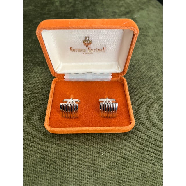 Sir Norman Hartnell (19011979) A Pair of Mid-Century Modern Cufflinks Presented in their original box Gold plated metal...