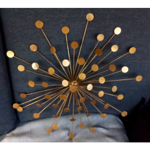 Get ready to make a striking statement with a bold, beautiful, and balanced sunburst wall piece. This vintage atomic-...