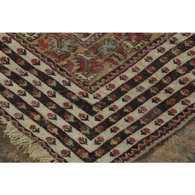Hand-knotted in wool, this 4x6 Vintage Turkish Anatolian Prayer Rug, circa 1950–1959, features a deep blue mihrab framed...