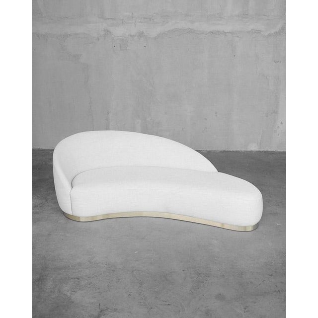 Unique shaped Mid-century sofa from the 1950s. It has elegant curves and it's been freshly reupholstered in a quality...