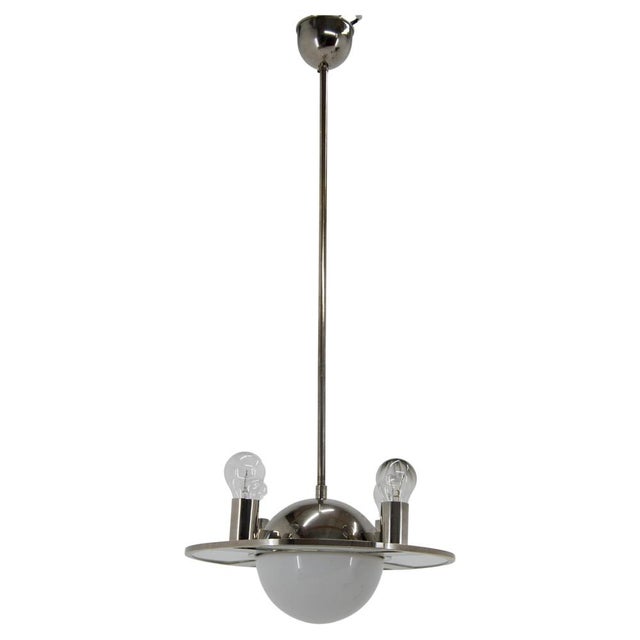 Unique bauhaus or functionalist chandelier from 1920s made of nickel, sand blasted glass and opaline glass. A rare and...