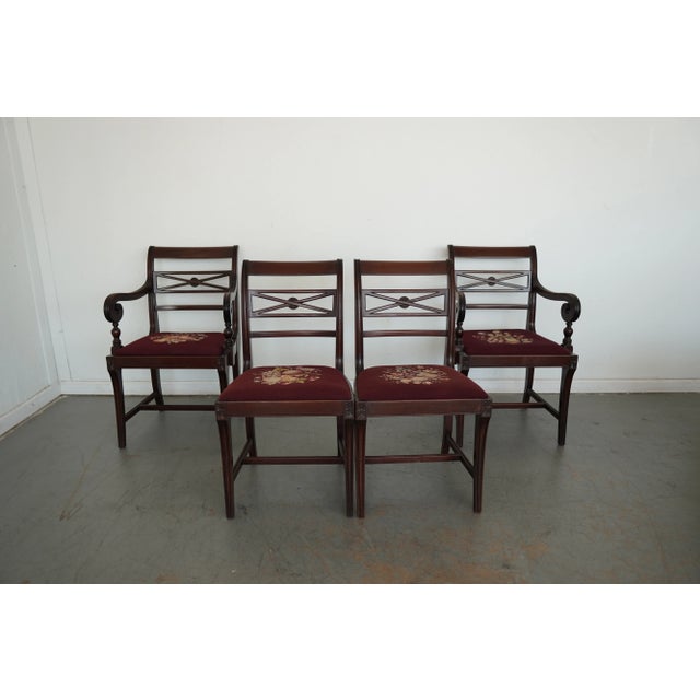 Elegant set of four Federal Revival dining chairs, including two armchairs and two side chairs, crafted in the early to...
