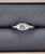 This stunning platinum ring features a brilliant round center diamond weighing 0.73 carats, radiating exceptional sparkle...