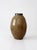 This vintage handmade studio pottery vase features a rounded form with softly ribbed detailing and a warm earth-toned...