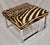 Cow Hide in Zebra Pattern Upholstered Bench Stool With Chrome Legs.
