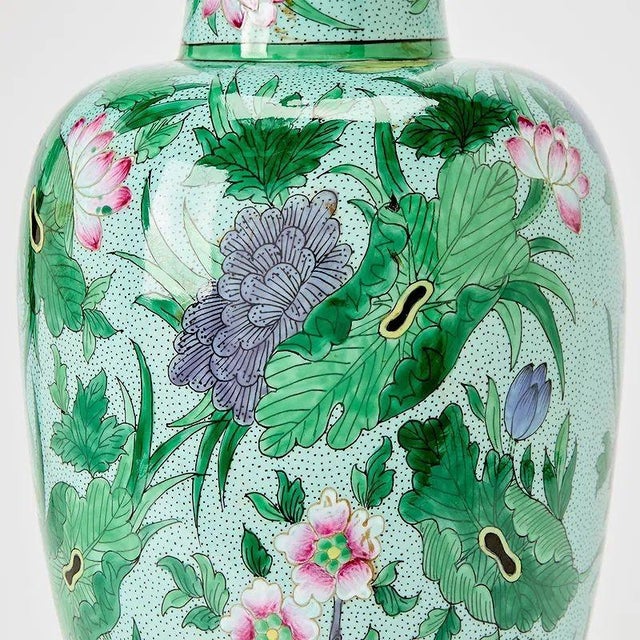This product is a pair of vintage Chinese enamel vases that have been transformed into lamps. The vases have a beautiful...