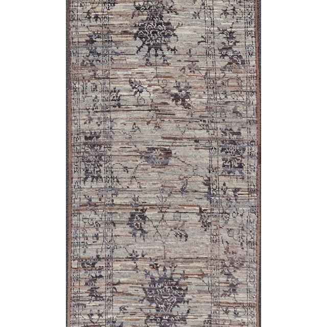 Measures: 3'1 x 8'4. This modern casual tribal runner has been hand-knotted in wool. The runner features a modern sub-...