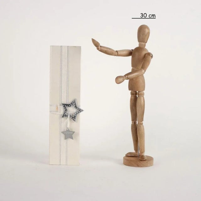 Christmas gift themed box containing watch with leather strap and small rhinestones. This piece is attributed to the...