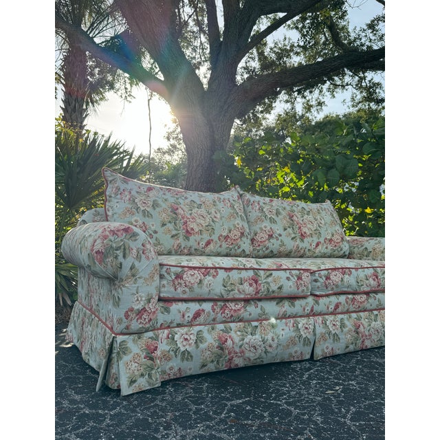 Bring timeless charm and cozy elegance into your home with this beautiful vintage floral upholstered sofa, featuring a...