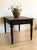 A 19th-century English pine work table with a wonderfully time-softened surface. The wide plank top shows the gentle...