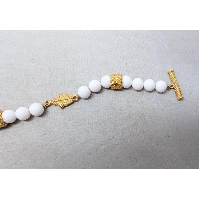 Metal Vintage 1980s Signed Givenchy Goldtone & White Resin Leaf Toggle Bracelet For Sale - Image 7 of 8