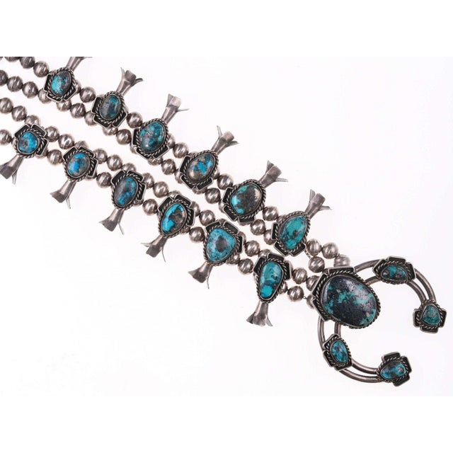 Vintage Navajo Silver and turquoise squash blossom necklace, twelve blossoms<br>each set with a turquoise cabochon,...
