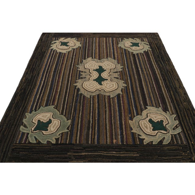 Description: A rare 6x7 antique hooked rug of United States provenance, handmade in wool and fabric circa 1920-1930,...