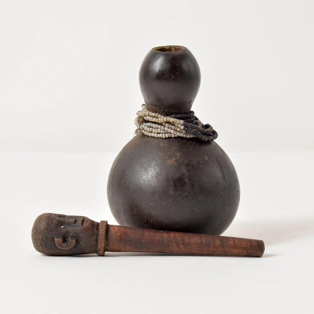 The Nyamwezi diviner's medicine gourds were used to contain medicinal contents used in divination and the community's...