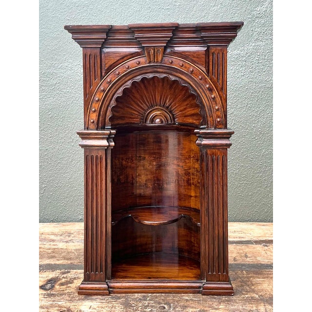 This vintage carved wood architectural niche is a striking decorative accent, showcasing a timeless arched silhouette...