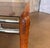 A stylish vintage side table featuring a solid oak frame, smoked glass top, and sleek chrome stretcher bars. Clean, modern...