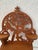 Whimsical wood hanging wall shelf featuring three platforms for object display. Intricate fretwork features a ladder...