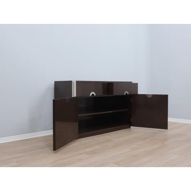 Capture the essence of 1970s italian sophisticated minimalism with this exceptional small sideboard by mario sabot. This...