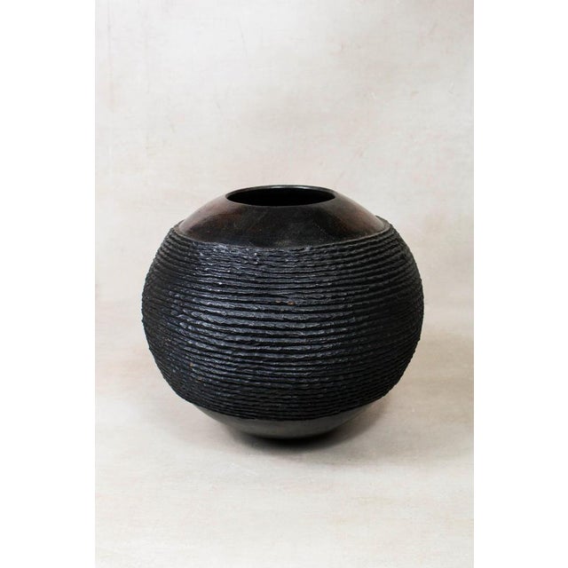 The Zulu pot, originating from South Africa, holds a distinguished role in the traditional practices of the Zulu people,...