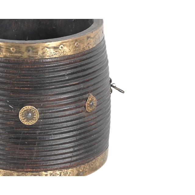 This Vintage Indian Teakwood and Brass Pot is handcrafted from richly patinated teakwood and accented with engraved brass...