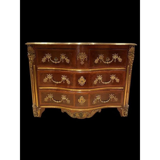 A stunning french 19th century louis xv st. Four-drawer kingwood, tulipwood and ormolu commode. The bombe shaped commode...