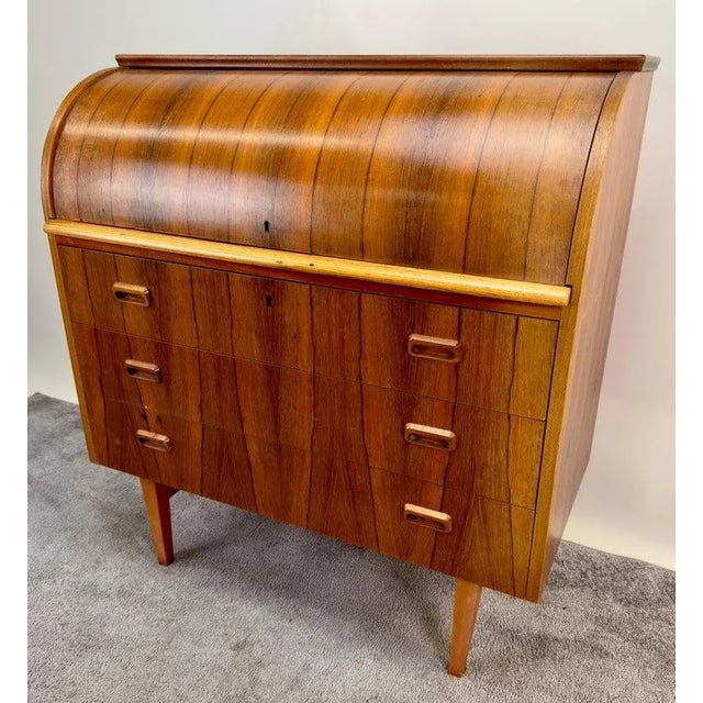 A rare Bernhardt Pedersen & Son Danish Mid Century Modern roll top writing desk crafted from beautifully grained rosewood,...