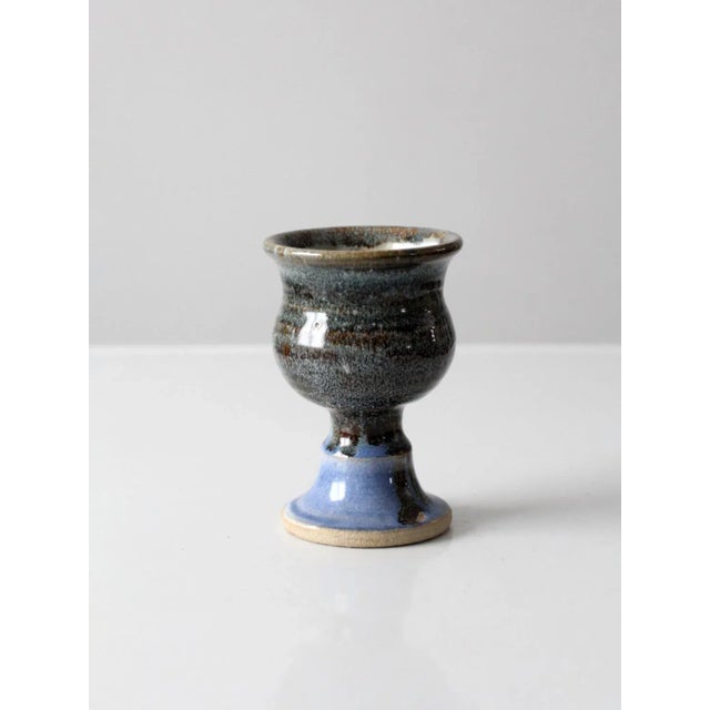 This is a vintage studio pottery cup. The hand-crafted studio pottery chalice makes a lovely serving bowl for nuts or...