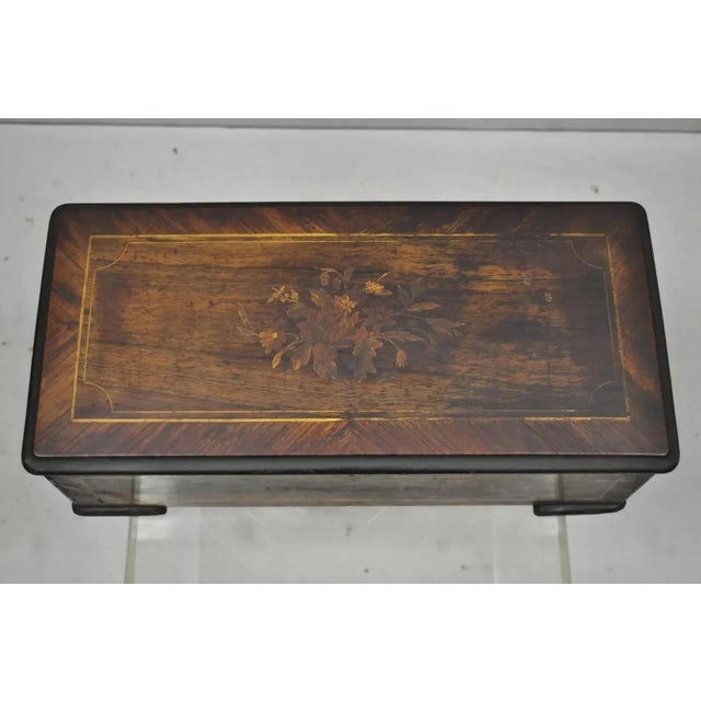 Antique Swiss Continental Marquetry Inlay Cylinder Music Box by A.V. Bornard. Item features interior glass cover, 8 songs,...