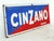 Vintage Cinzano Vermouth advertising sign made of enameled steel. It features a blue and red background and white...