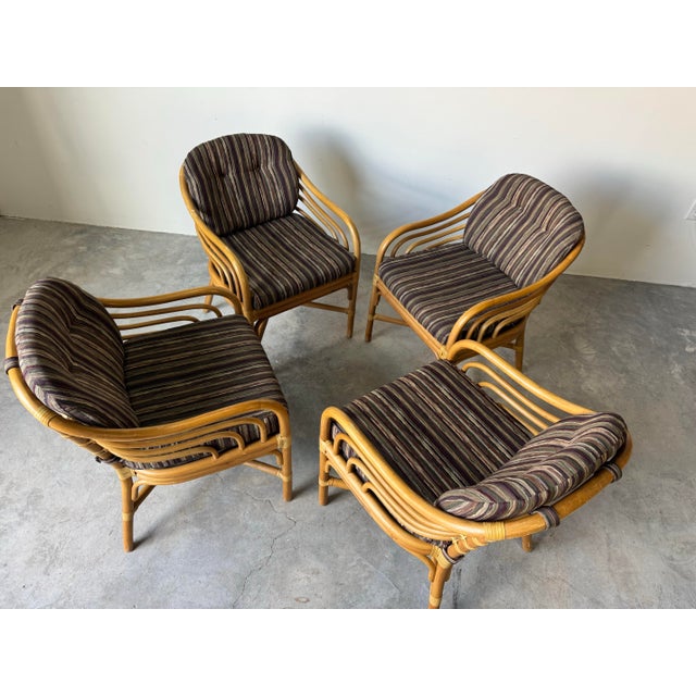 Elegant set of four vintage dining chairs by Brown Jordan, crafted in warm honey-toned rattan with their signature...